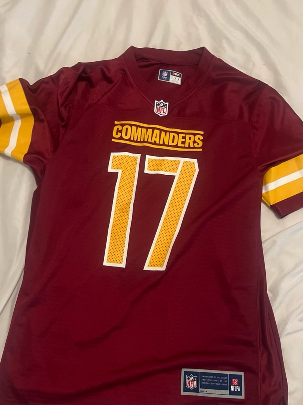 NFL Burgundy Football Jersey with White and Gold Accents